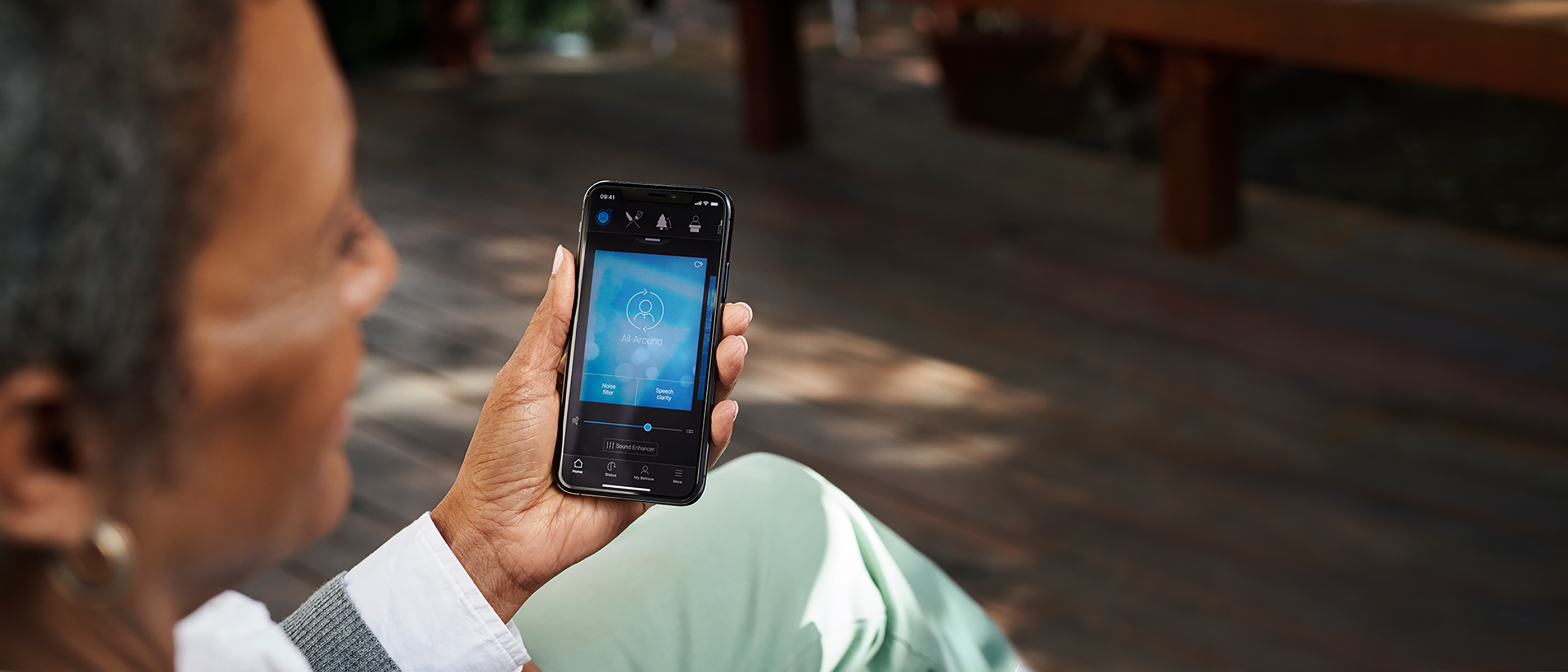 Lady using Beltone Hearmax app