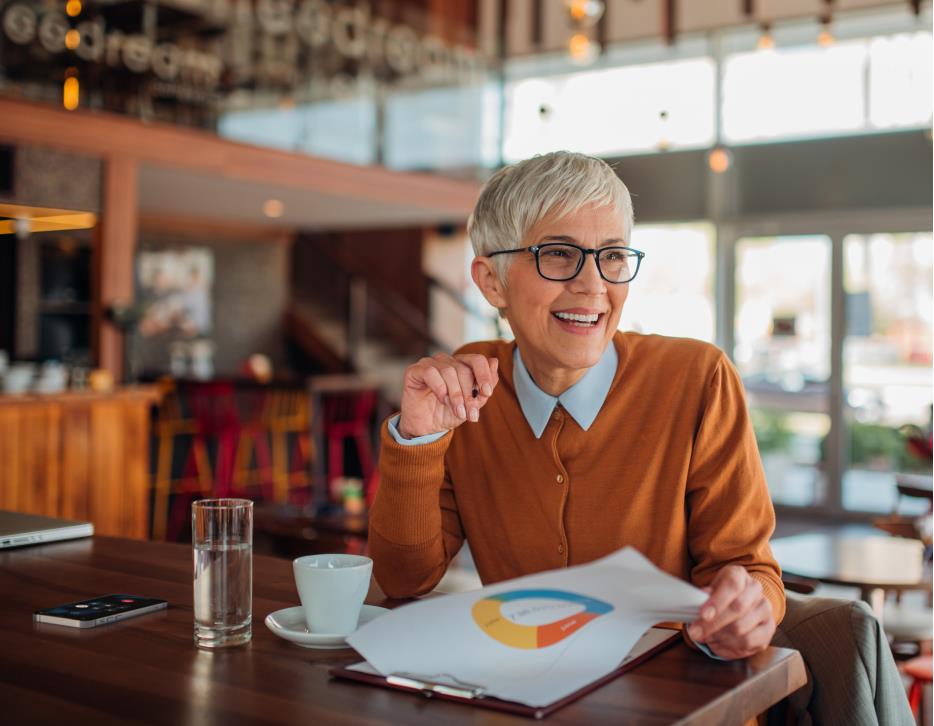 Woman drinking coffee at a table