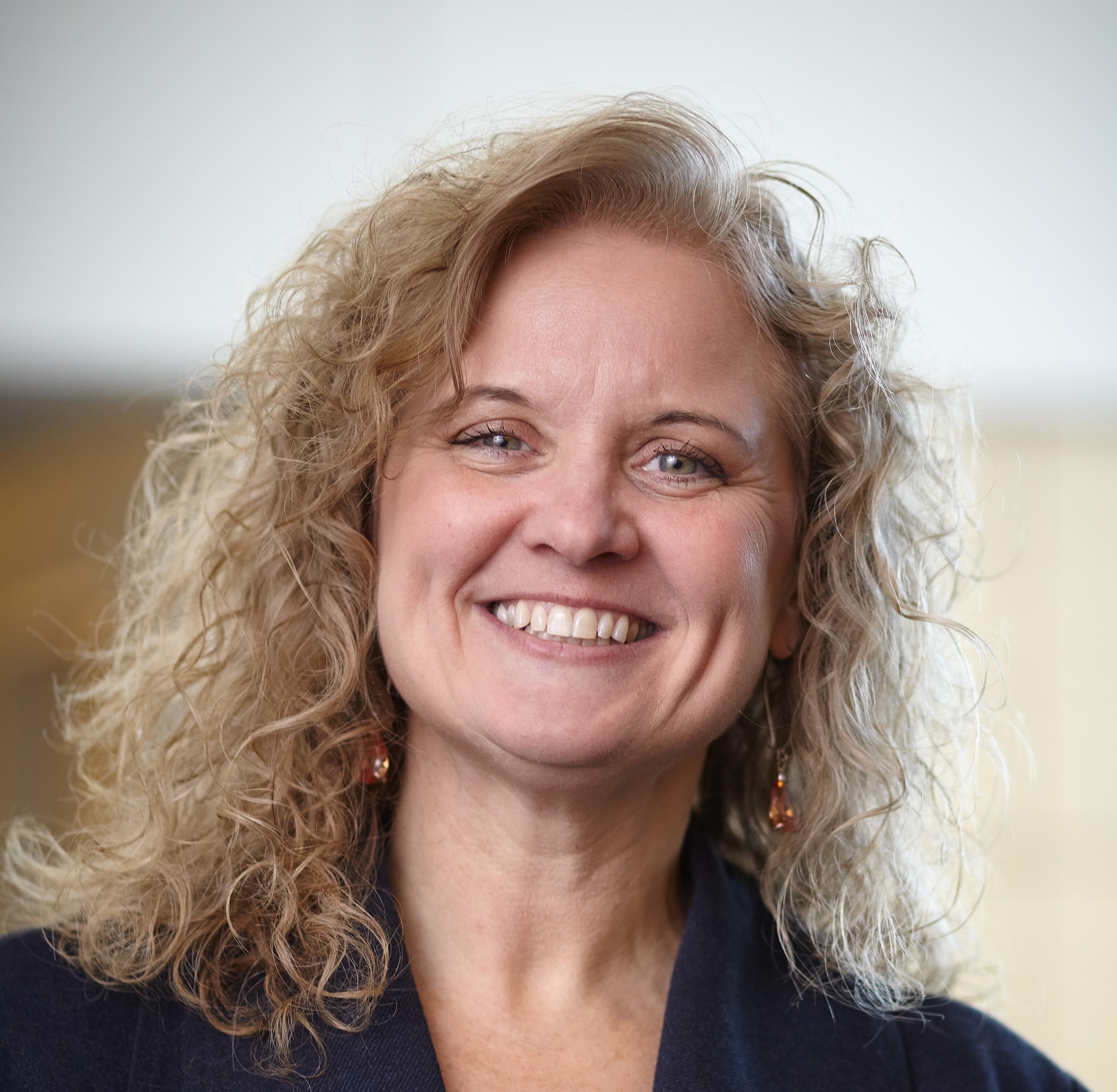 Portrait of Julie Quandt, Beltone Trust hearing aid user. 