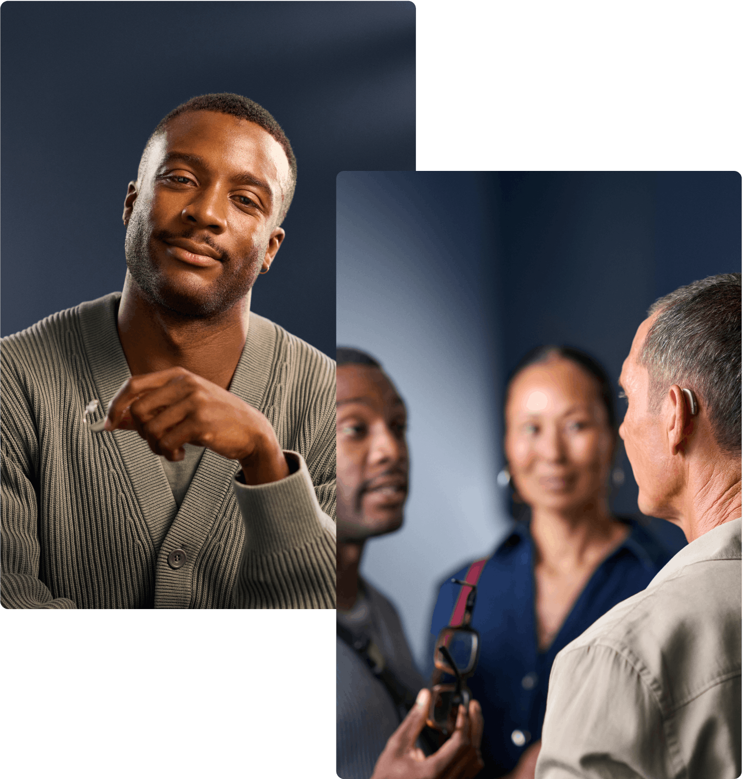 A man with a hearing aid and another man engage in a focused conversation, while a woman listens.