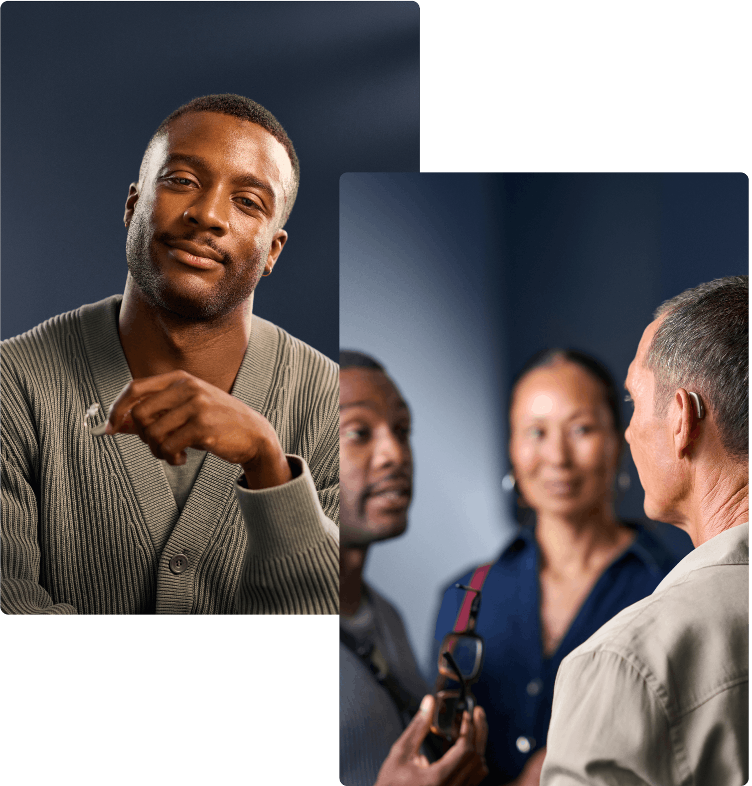 A man with a hearing aid and another man engage in a focused conversation, while a woman listens.